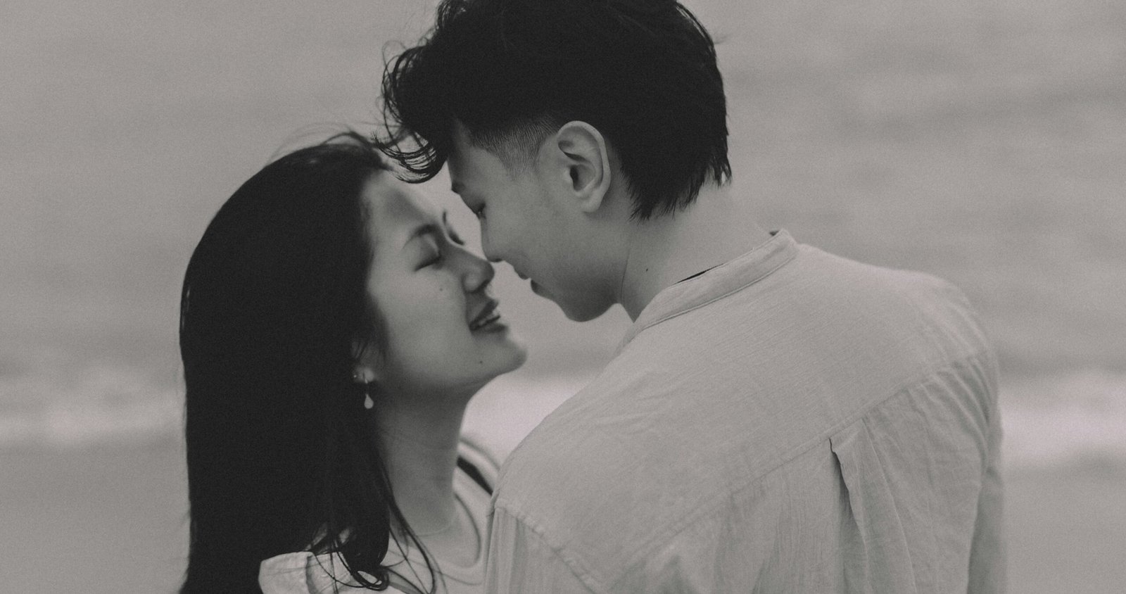 Couple embracing on a beach at sunset